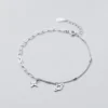 39be3e7dd8d029eebf72aa782c15f78b Sterling Silver Cut Out Dangly Galaxy Charm Bracelet