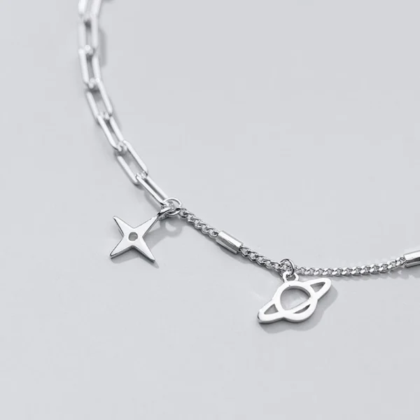 47e3dc3b36f7427f69d4795c5e9a430e Sterling Silver Cut Out Dangly Galaxy Charm Bracelet