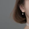 8310fab0b9d8f32e6b9d28aa9a155d3e Sterling Silver Freshwater Pearl Cubic Zirconia Drop Earrings