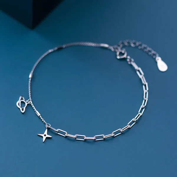 b222d37954a1aaba5bae54f5e6937552 Sterling Silver Cut Out Dangly Galaxy Charm Bracelet