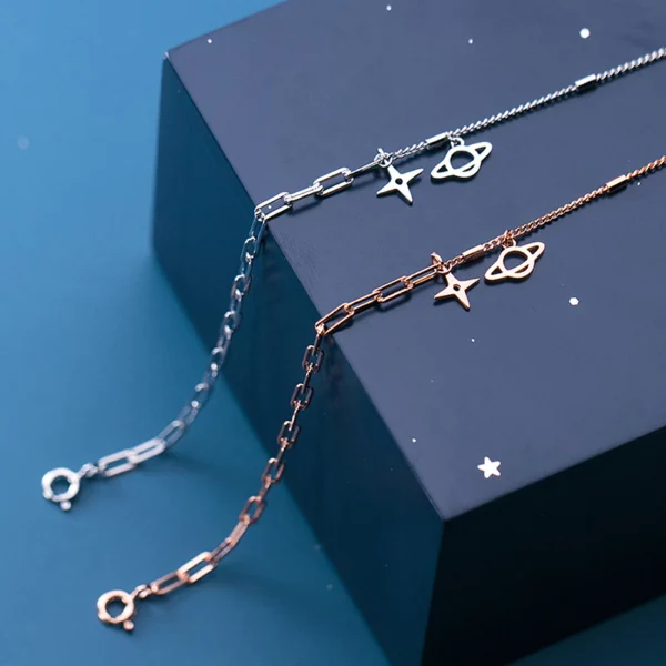 f06da3e23d230d2e51127bde41c4bdfa Sterling Silver Cut Out Dangly Galaxy Charm Bracelet